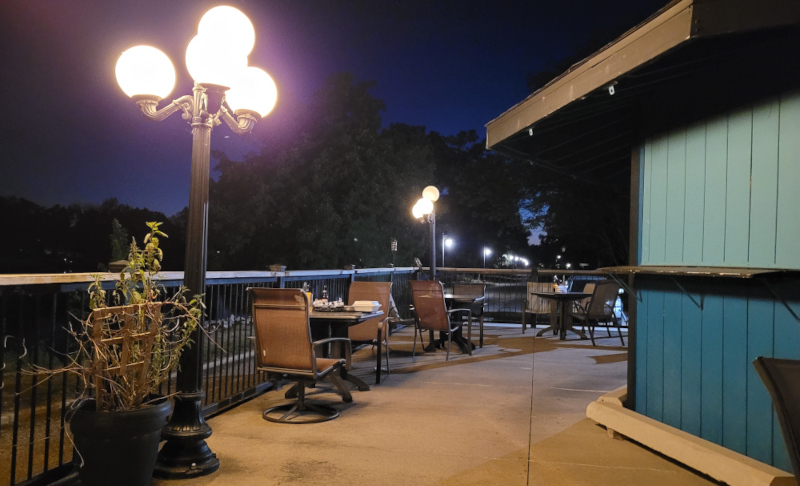 Outdoor restaurant seating along Cedar River